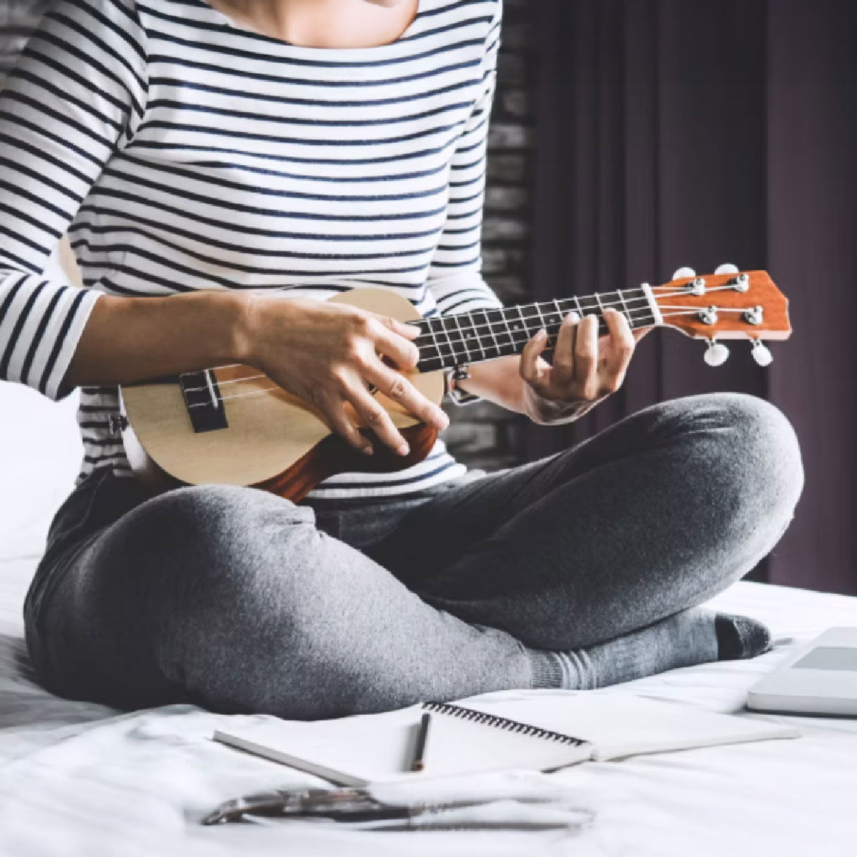 Girl playing ukulele